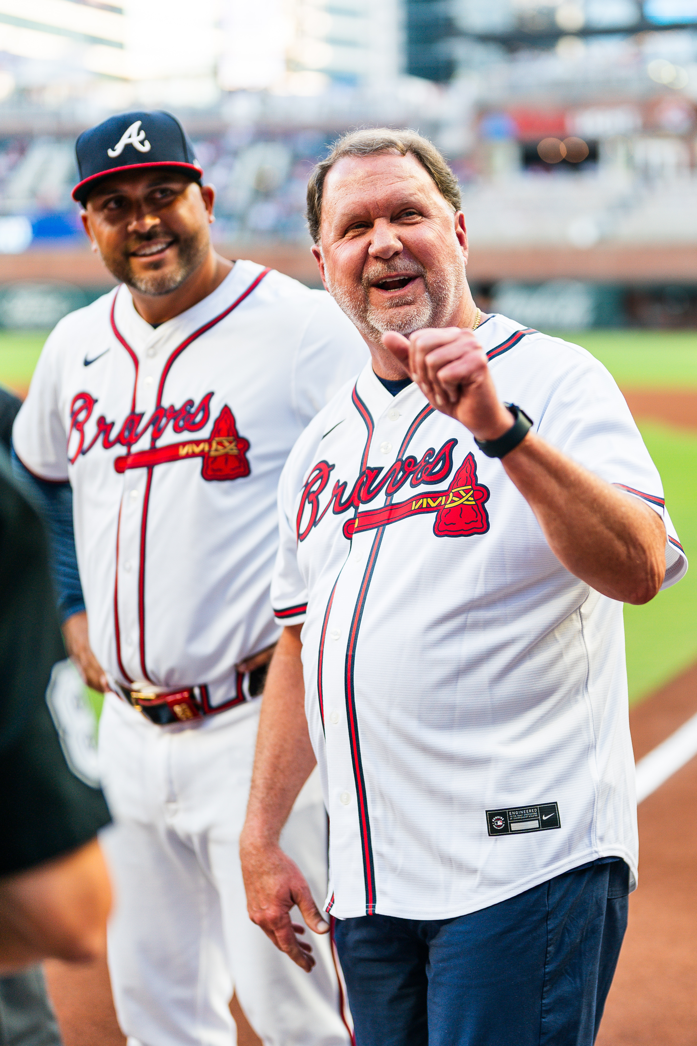 Larry in a Braves uniform standing next to Matt Tuiasosopo, the Braves' Third Base Coach. 