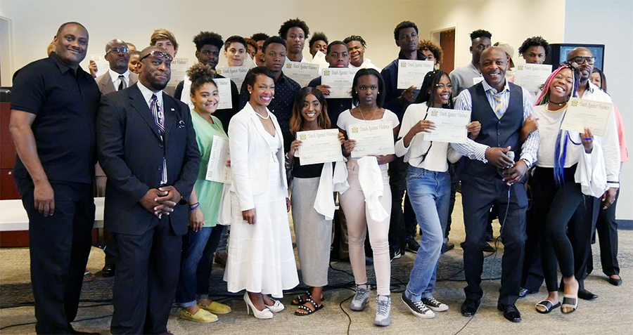 Douglasville Mayor Rochelle Robinson and Police Chief Gary Sparks celebrate with graduates of the Youth Against Violence program. Photo courtesy of the City of Douglasville.