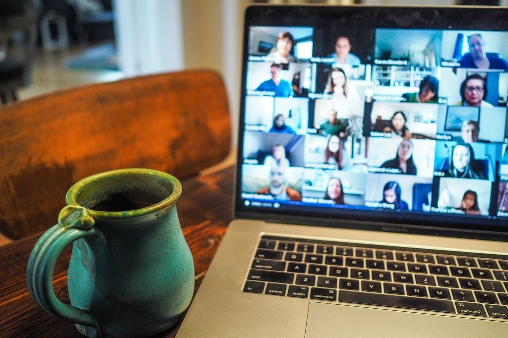 Picture of a virtual meeting on a laptop.